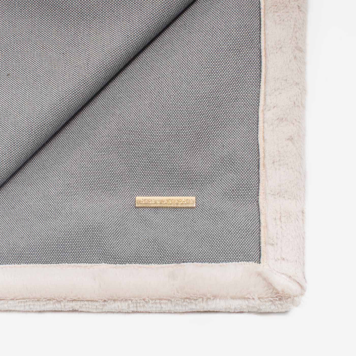 Present your furry friend with our luxuriously thick, plush blanket for your pet. Featuring a reverse side with hardwearing woven fabric handmade in Italy for the perfect high-quality pet blanket! Essentials Twill Blanket In Slate, Available now at Lords & Labradors