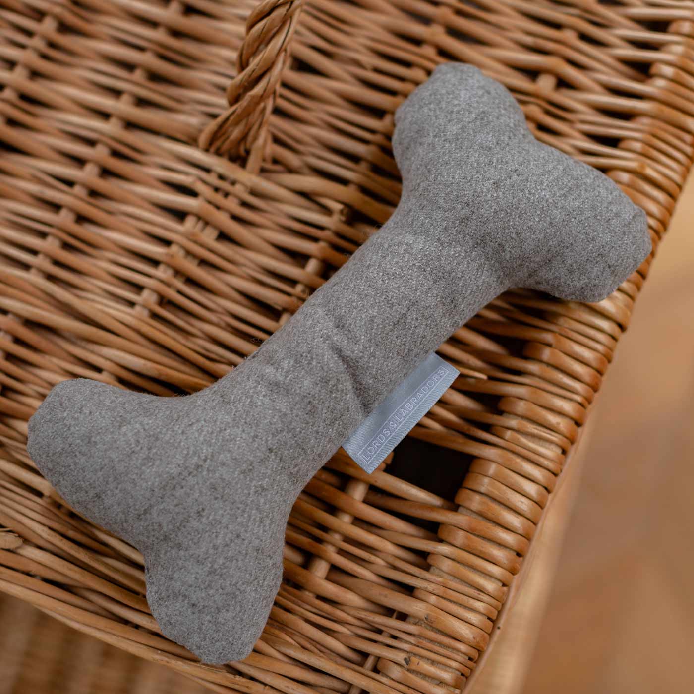 Present the perfect pet play-time with our luxury dog bone toy in stunning Inchmurrin Ground Dark Grey! Available to personalise now at Lords & Labradors, Shop Luxury Dog Toys Online