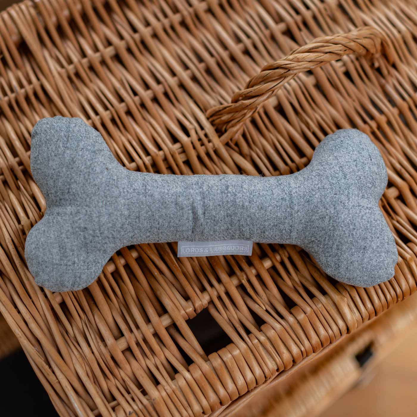 Present the perfect pet play-time with our luxury dog bone toy in stunning Inchmurrin Iceberg Light Grey! Available to personalise now at Lords & Labradors, Shop Luxury Dog Toys Online