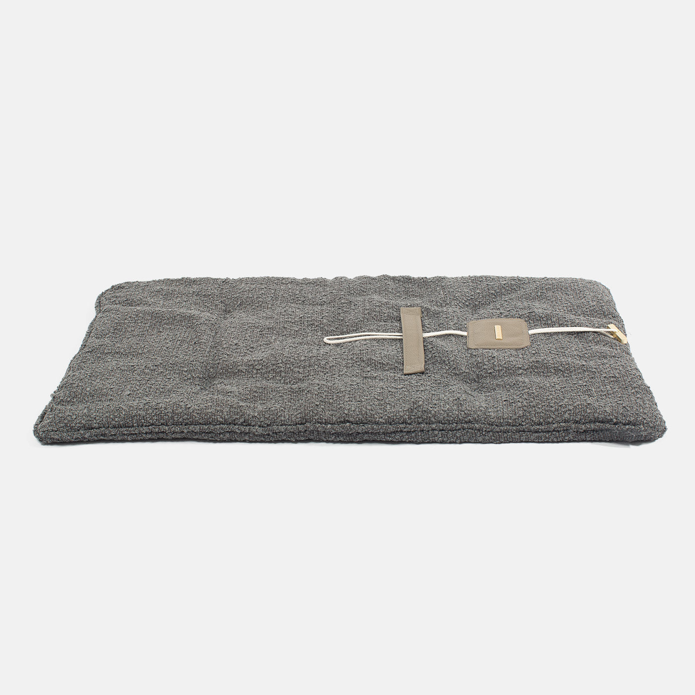 Embark on the perfect pet travel with our luxury Travel Mat in Granite Boucle. Featuring a Carry handle for on the move once Rolled up for easy storage, can be used as a seat cover, boot mat or travel bed! Available now at Lords & Labradors