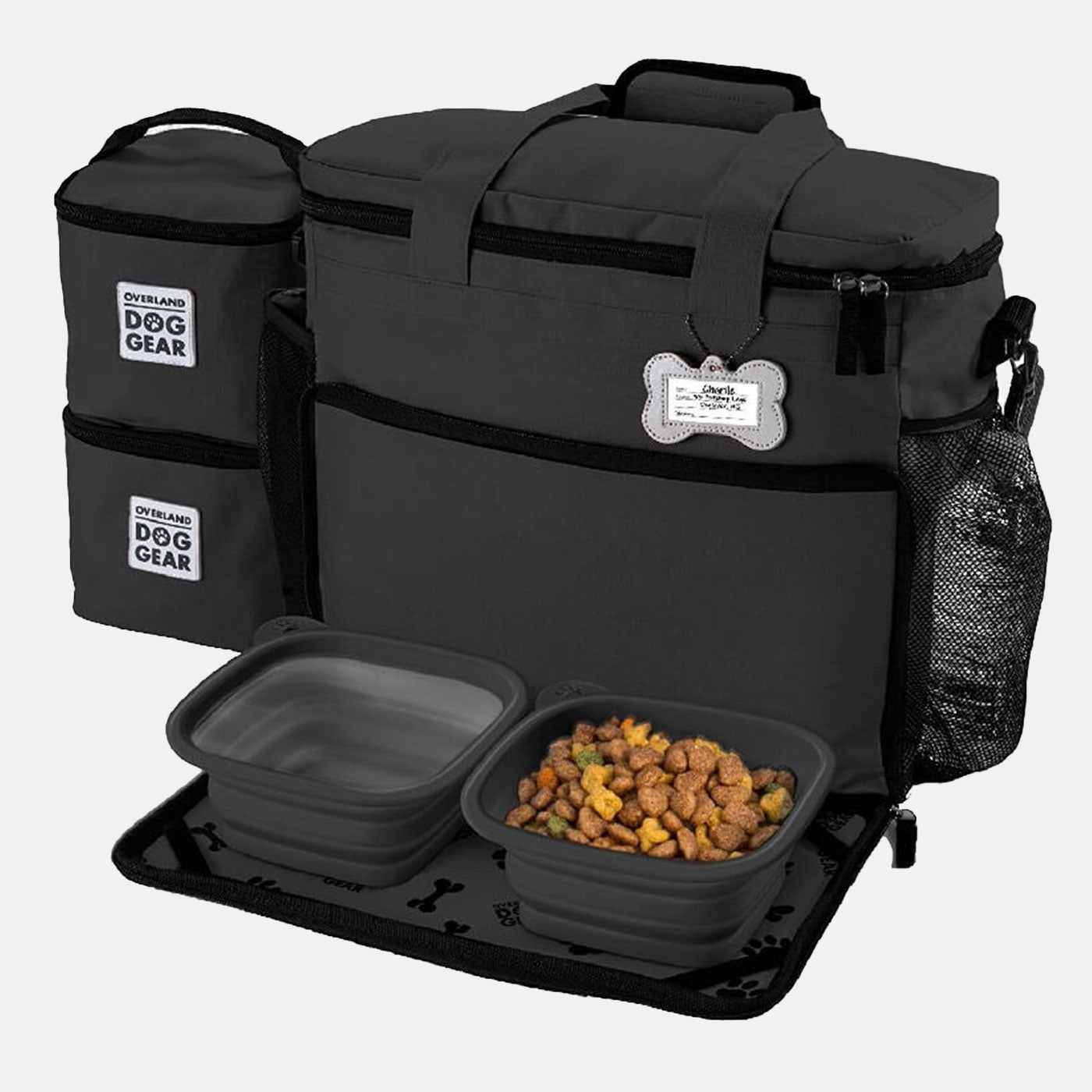 Discover, Mobile Dog Gear Week Away Bag, in Black. The Perfect Away Bag for any Pet Parent, Featuring dividers to stack food and built in waste bag dispenser. Also Included feeding set, collapsible silicone bowls and placemat! The Perfect Gift For travel, meets airline requirements. Available Now at Lords & Labradors