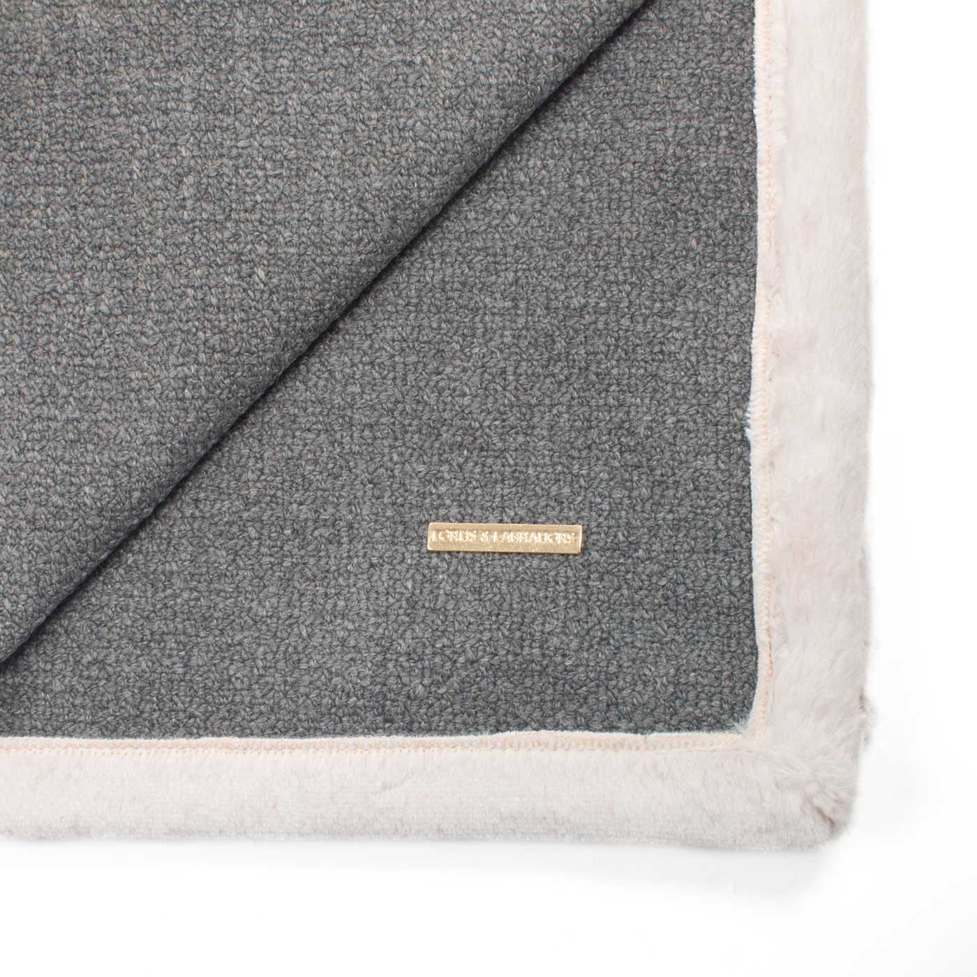 Present your furry friend with our luxuriously thick, plush blanket for your pet. Featuring a reverse side with hardwearing woven fabric handmade in Italy for the perfect high-quality pet blanket! Essentials Herdwick Blanket In Graphite, Available now at Lords & Labradors    