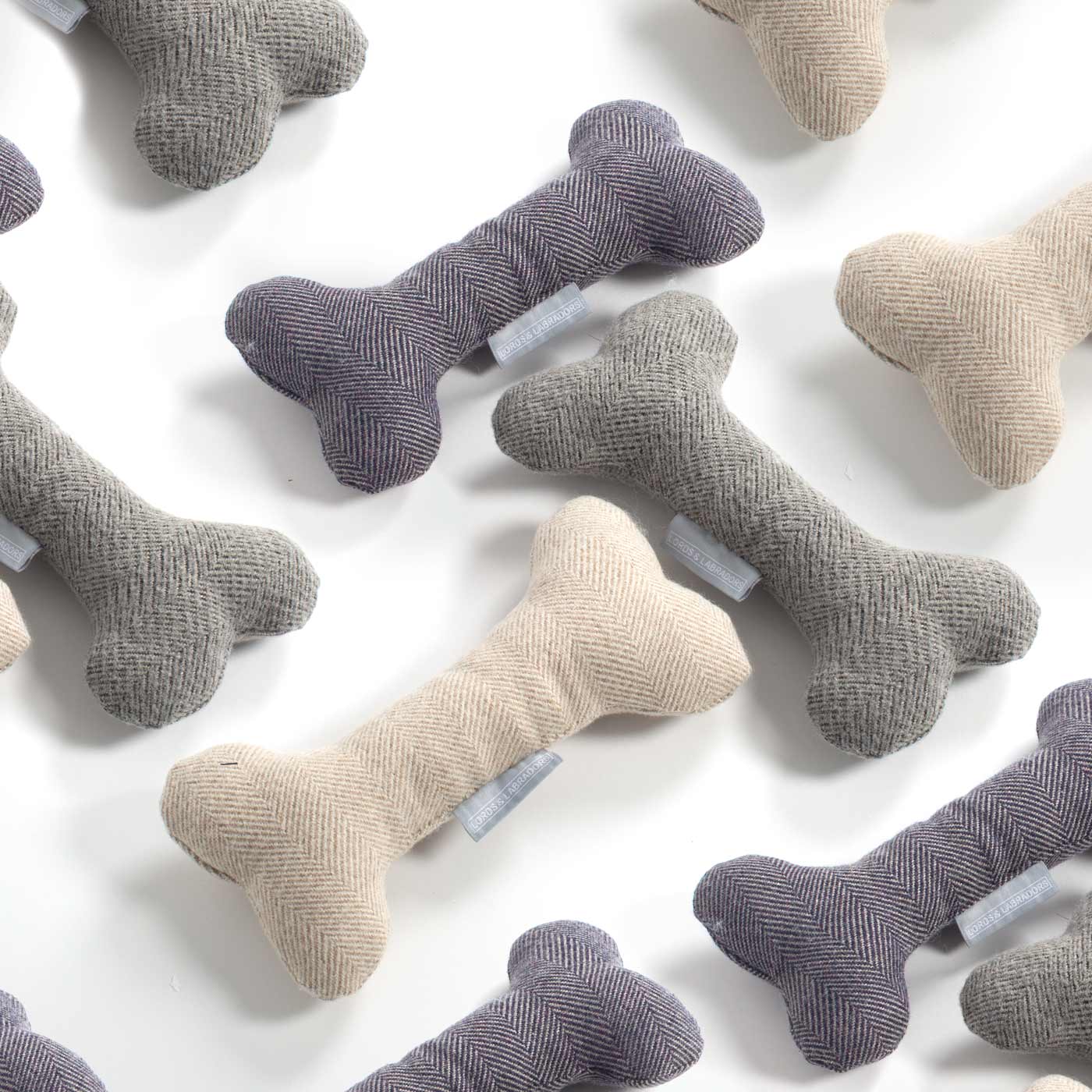 Present The Perfect Pet Playtime With Our Luxury Dog Bone Toy, In Stunning Herringbone Tweed! Available To Personalise Now at Lords & Labradors 