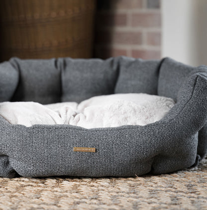Discover our luxury Herdwick oval dog bed in beautiful graphite, the ideal choice for dogs to enjoy blissful nap-time, featuring reversible inner cushion with raised sides for dogs who love to rest their head for the ultimate cosiness! Handcrafted in Italy for pure pet luxury! Available now at Lords & Labradors    