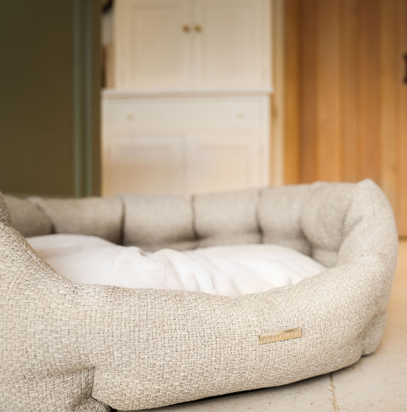 Discover our luxury Herdwick oval dog bed in beautiful sandstone, the ideal choice for dogs to enjoy blissful nap-time, featuring reversible inner cushion with raised sides for dogs who love to rest their head for the ultimate cosiness! Handcrafted in Italy for pure pet luxury! Available now at Lords & Labradors    