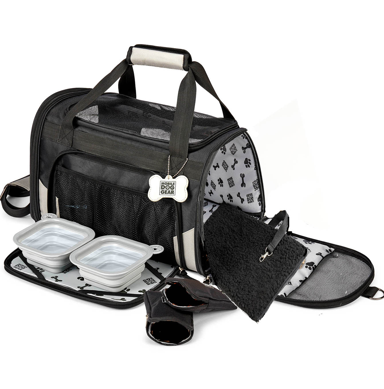 Discover, Mobile Dog Gear Pet Carrier, in Black. The Perfect Away Bag for any Pet Parent, Featuring dividers to stack food and removable padded Bottom. Also Included feeding set, collapsible silicone bowls and placemat! The Perfect Gift For travel, meets airline requirements. Available Now at Lords & Labradors