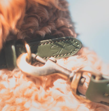 Sophie Allport forest green rope collar close up of logo embossing
