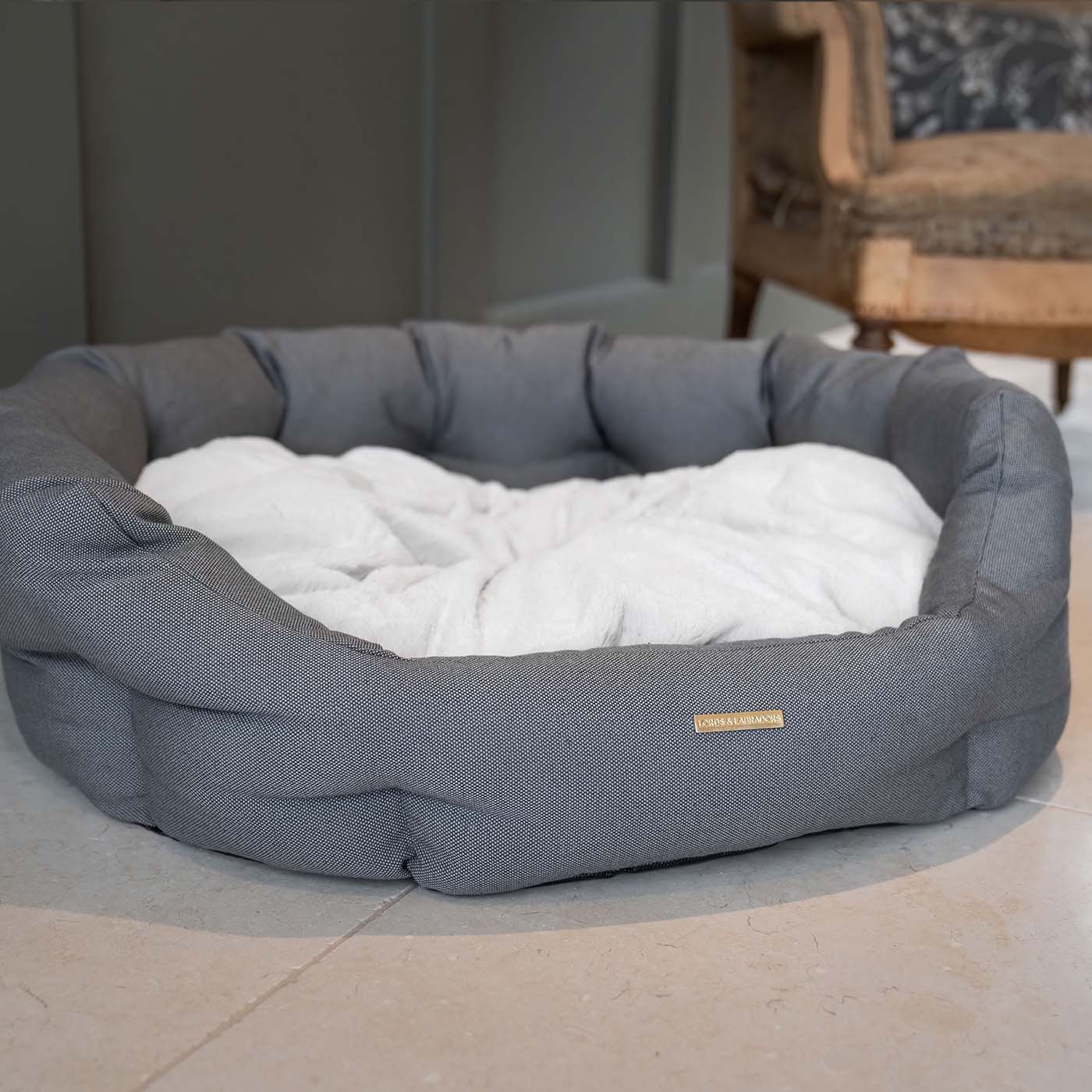 Discover our luxury twill oval dog bed in beautiful sandstone, the ideal choice for dogs to enjoy blissful nap-time, featuring reversible inner cushion with raised sides for dogs who love to rest their head for the ultimate cosiness! Handcrafted in Italy for pure pet luxury! Available now at Lords & Labradors    