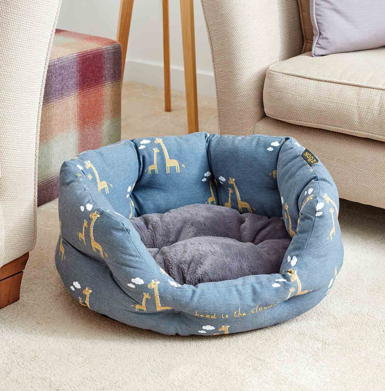 Zoon head in the clouds oval bed between to sofas